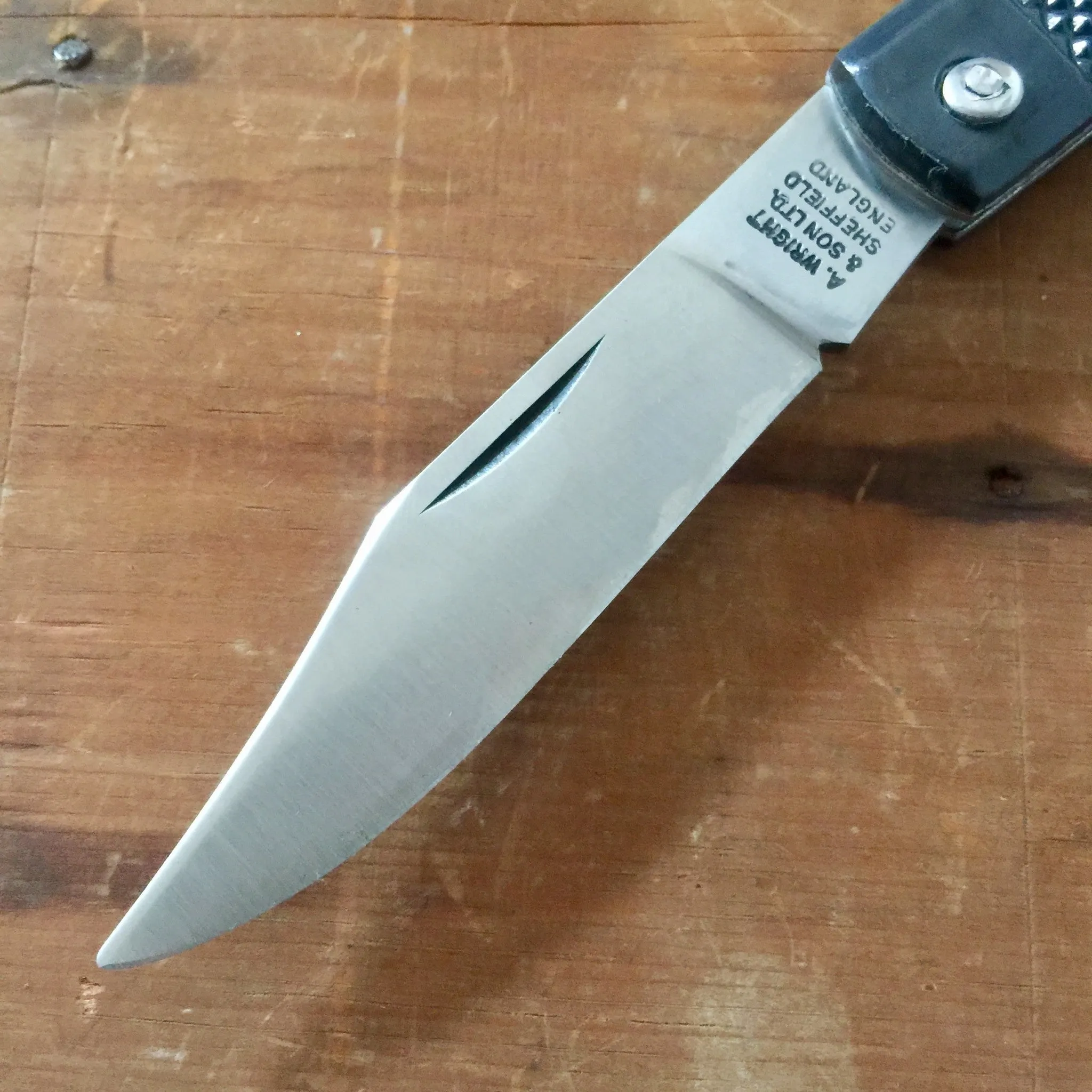 A Wright & Son Sheffield WW2 Issue Pattern 4 5/8" Clip Point Carbon Lockback Black Composite Handle