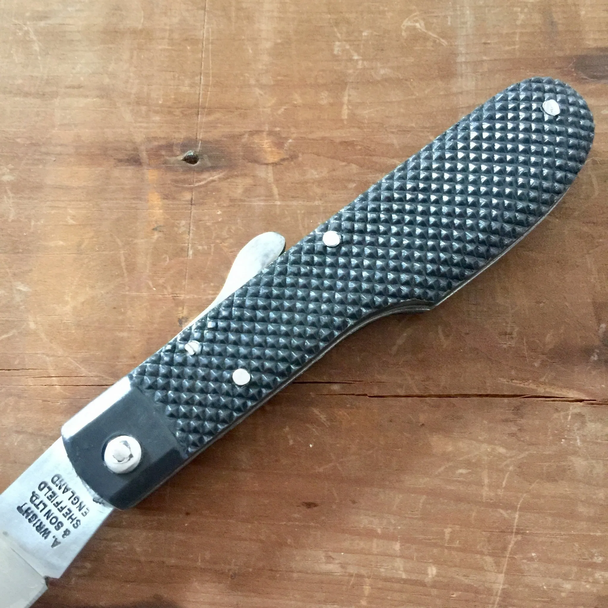 A Wright & Son Sheffield WW2 Issue Pattern 4 5/8" Clip Point Carbon Lockback Black Composite Handle